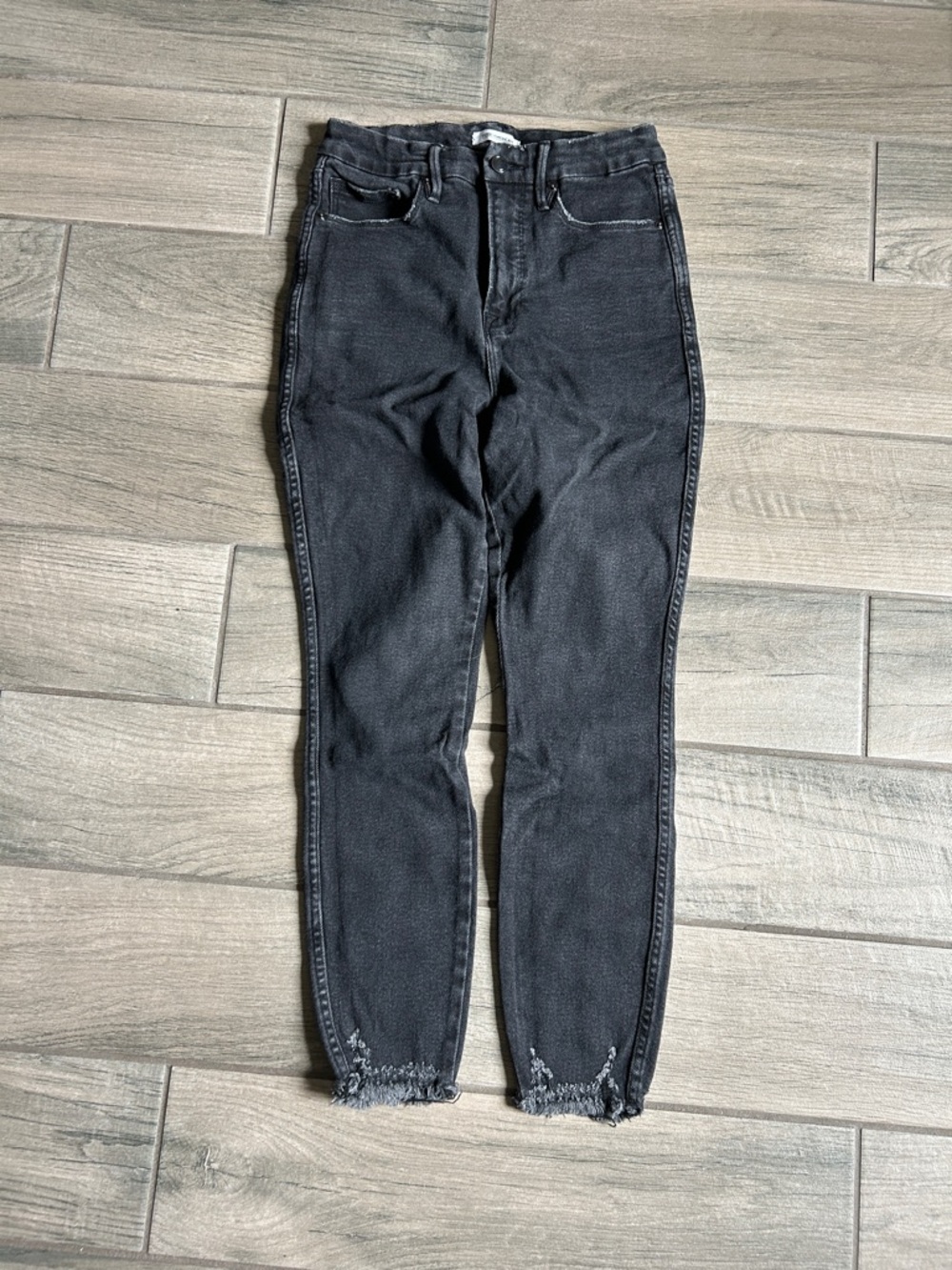 Good American Washed Black Skinny Jeans with Frayed Hem